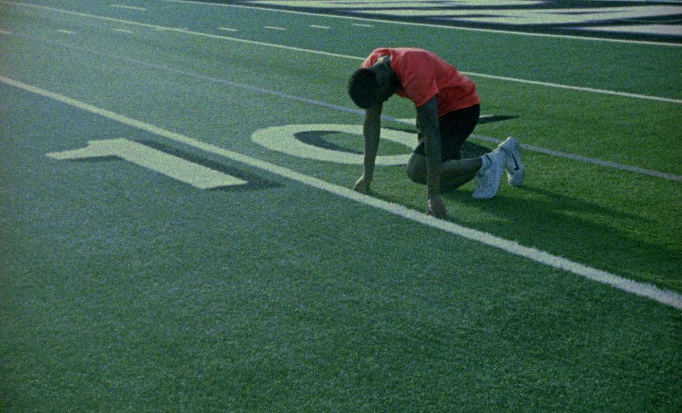Sprinter setting up in blocks